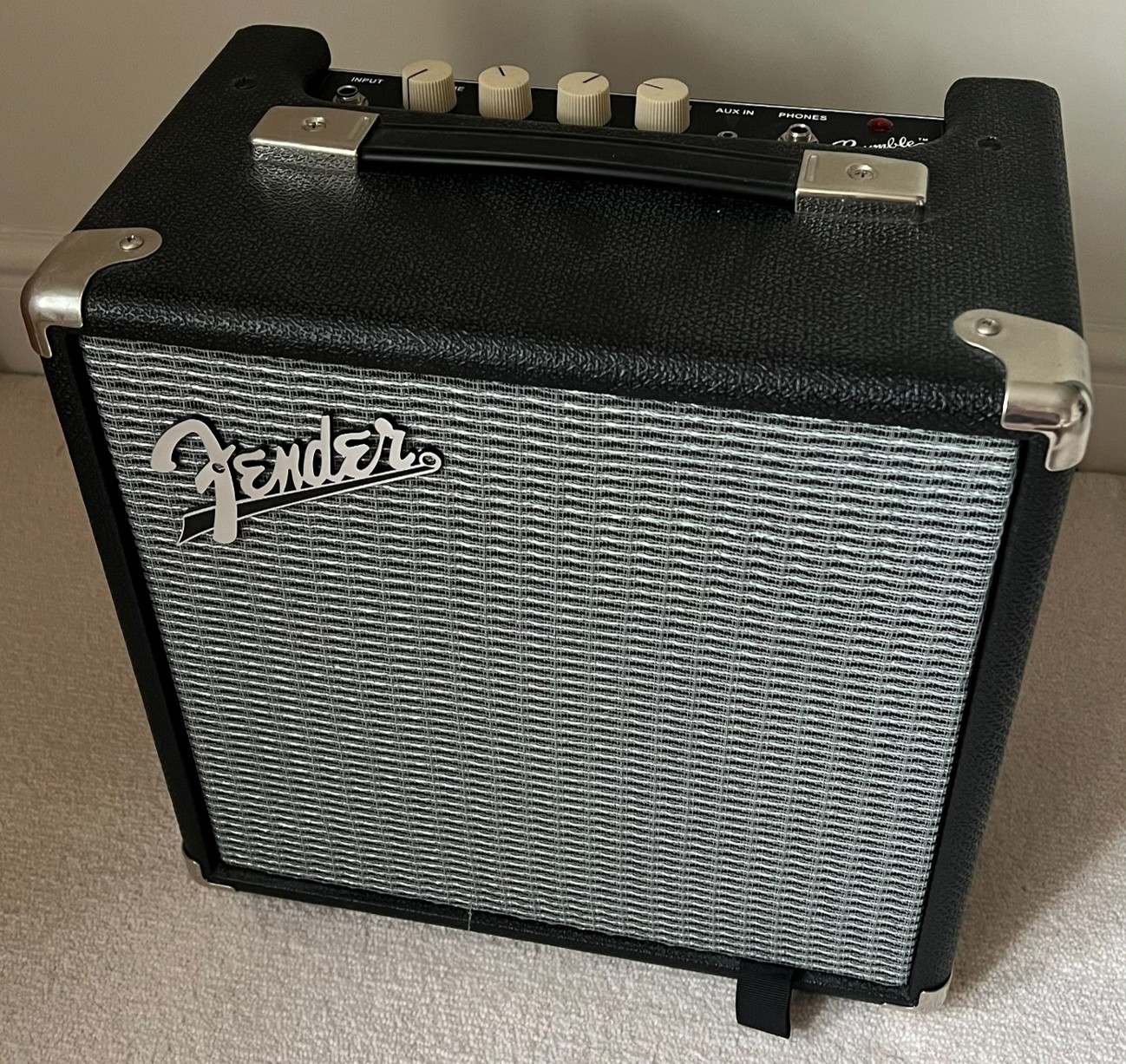 In‑room photo of Lottie’s Fender Rumble 15 practise amp.